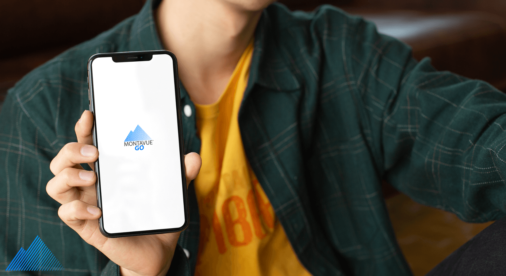 Man holding iPhone with MontavueGO app installed