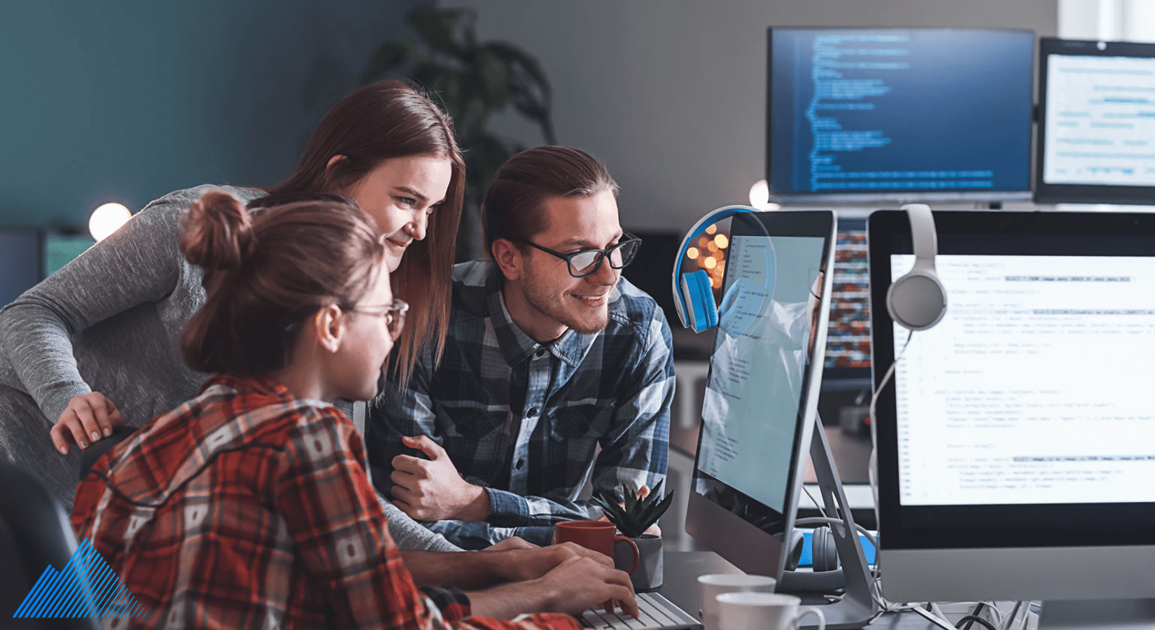 Team of coworkers looking at a computer screen