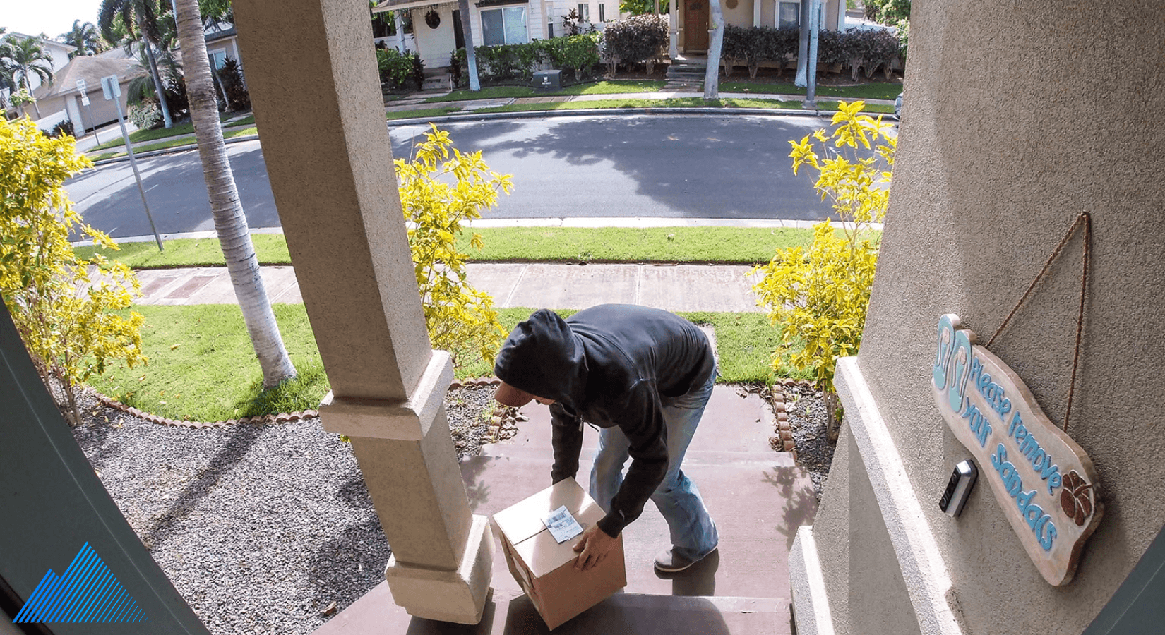 Person stealing a package from a front porch