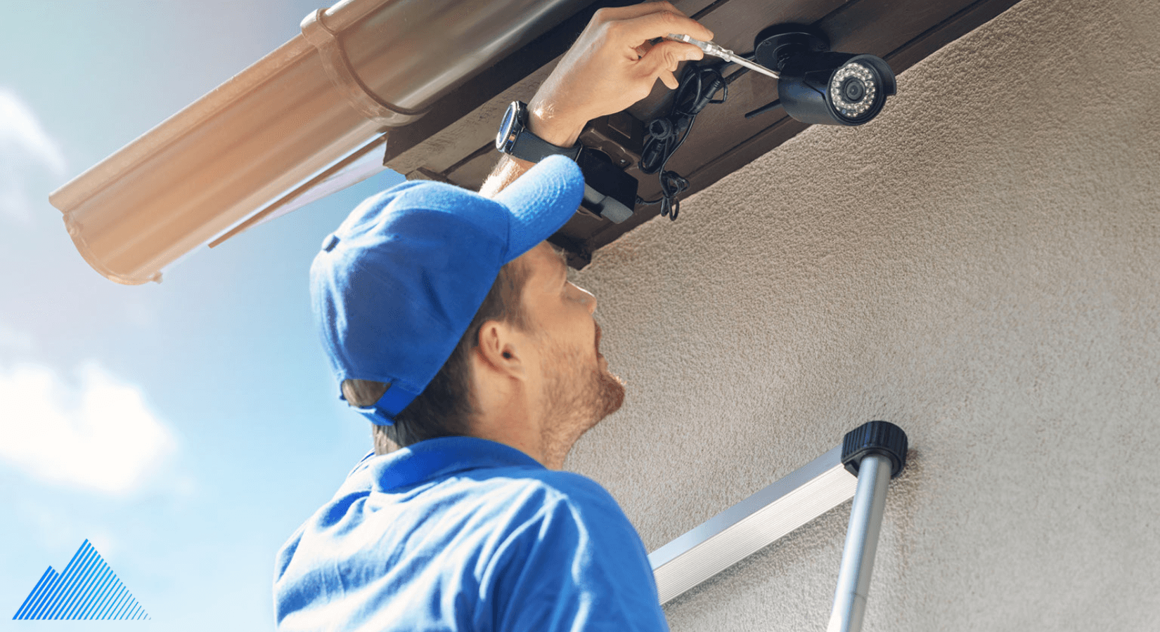 Professional installer installing a security camera outdoors