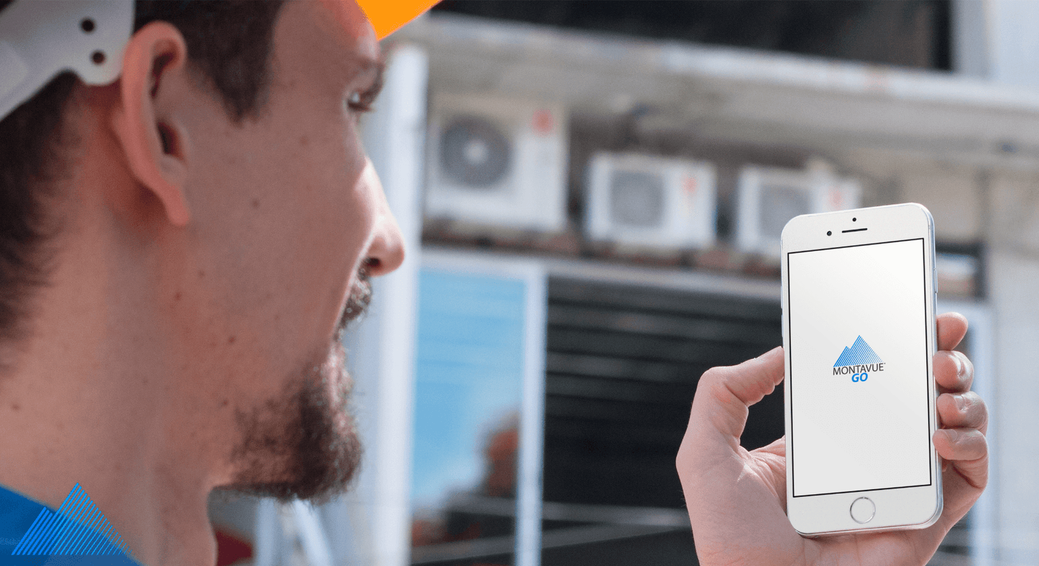 Construction worker holding iPhone with MontavueGO app