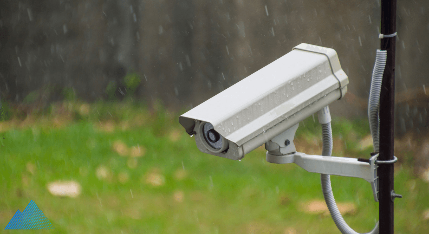 Security camera mounted on a pole in the rain